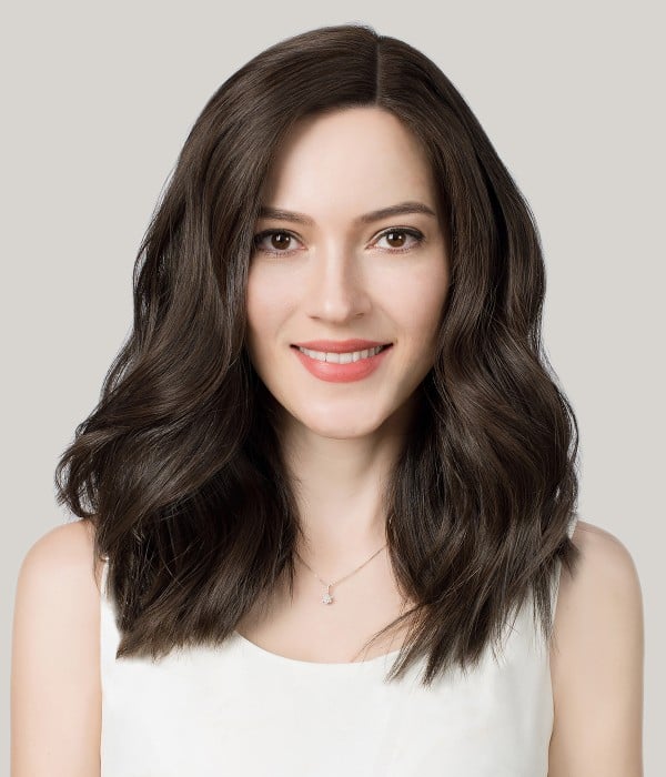 Woman with soft chestnut brown waves